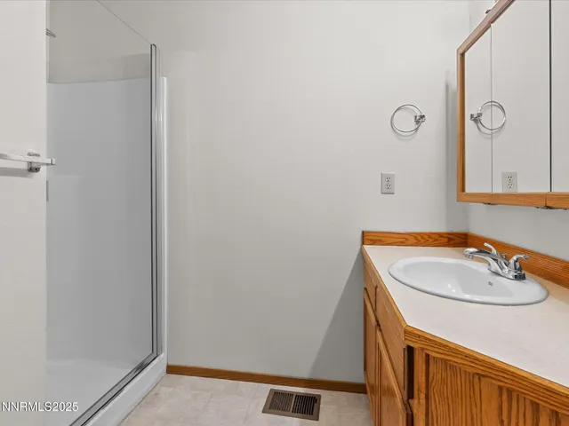 a bathroom with a sink a vanity and a mirror