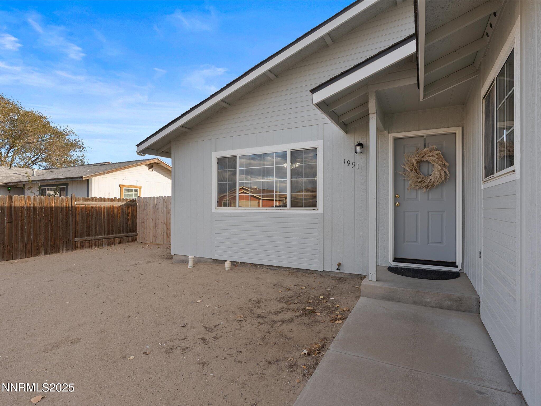 1951 Albert Street Fallon, NV 89406 - Photo 2 of 36 a view of a house with a wooden fence