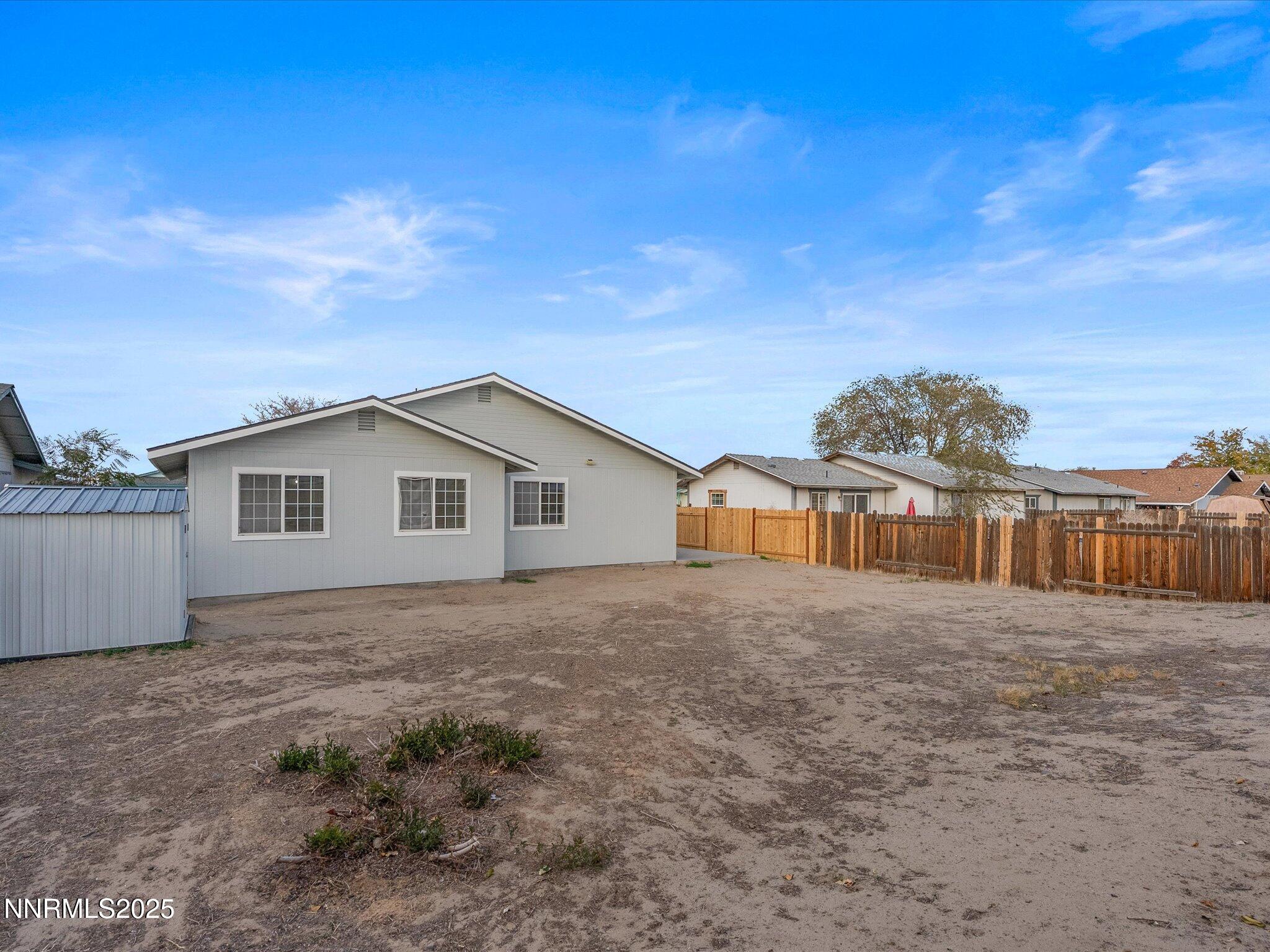 1951 Albert Street Fallon, NV 89406 - Photo 34 of 36 a view of a house with a yard and fence