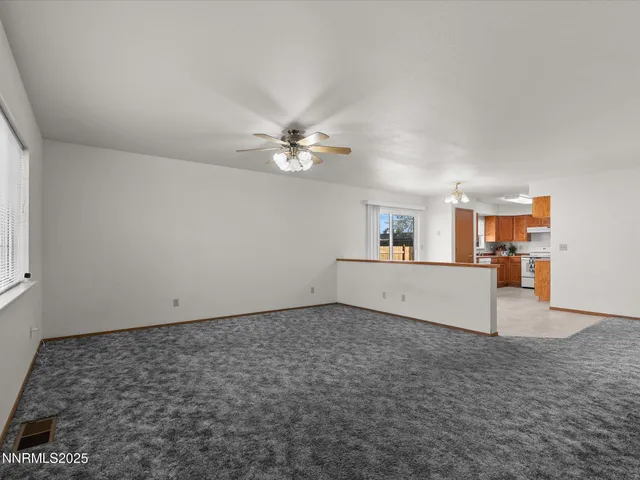 a view of a kitchen with furniture and chandelier