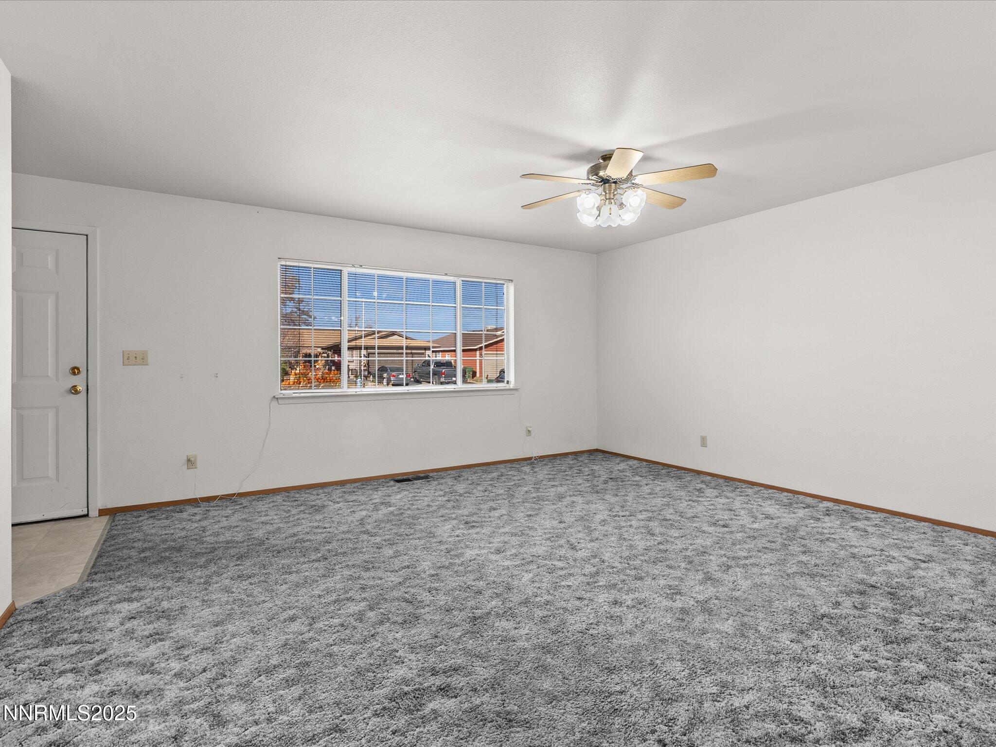 1951 Albert Street Fallon, NV 89406 - Photo 8 of 36 an empty room with windows and ceiling fan view