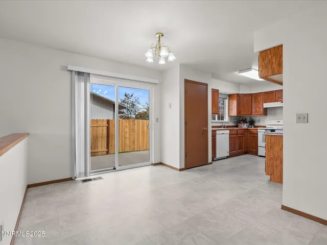 a view of a kitchen with a sink and cabinet