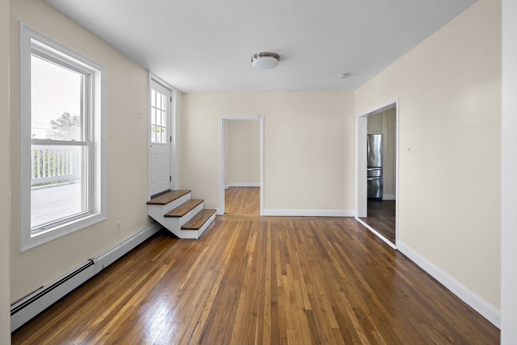 37 Union Street, Unit 2 Everett, MA 02149 - Photo 6 of 15 a view of wooden floor and windows in a room