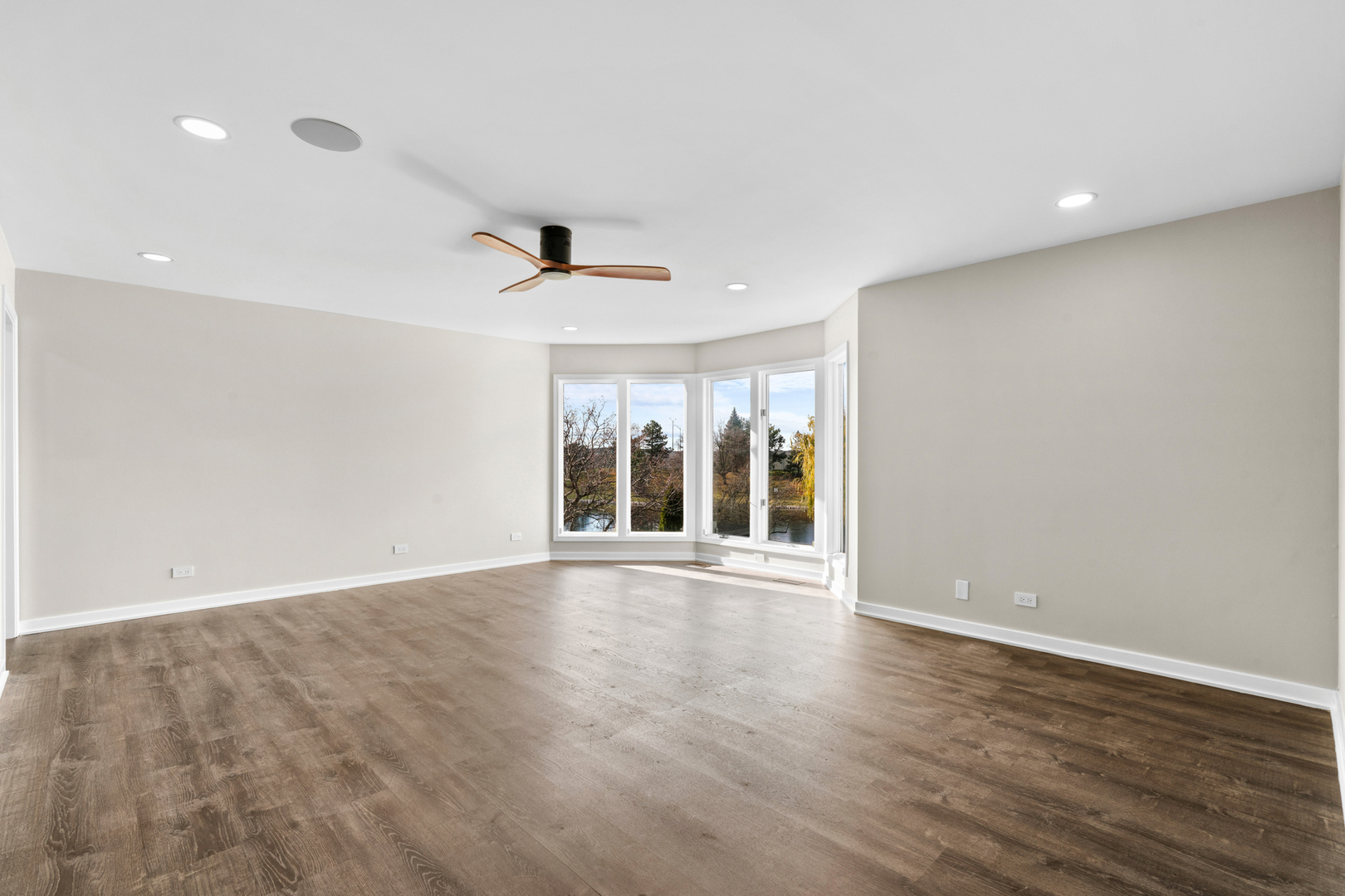 2500 Osage Drive Glenview, IL 60026 - Photo 23 of 77 a view of an empty room with wooden floor and a window