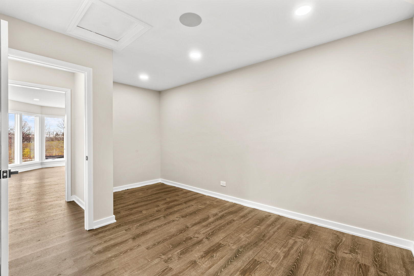 2500 Osage Drive Glenview, IL 60026 - Photo 28 of 77 an empty room with wooden floor and windows