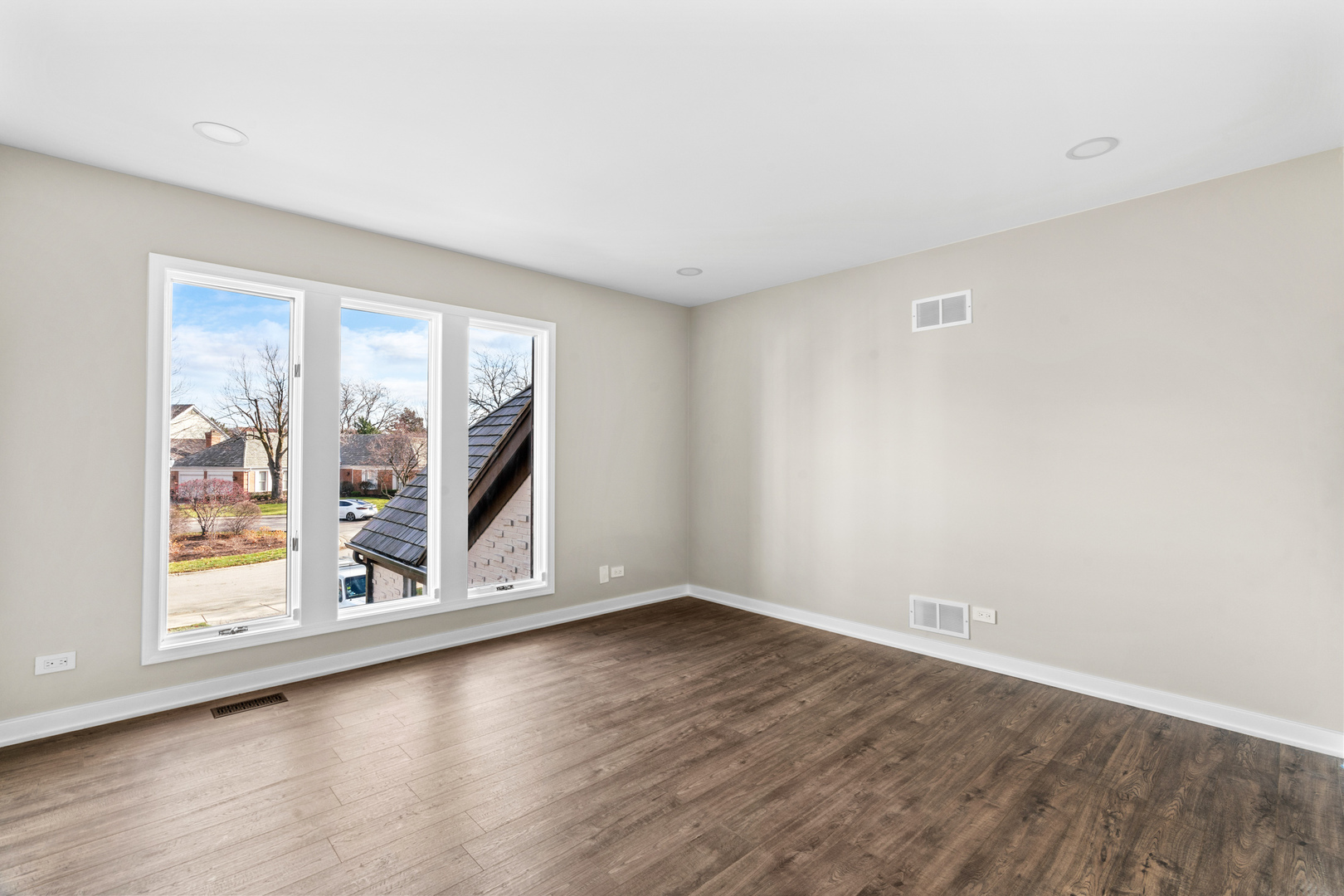 2500 Osage Drive Glenview, IL 60026 - Photo 35 of 77 a view of an empty room with wooden floor and a window