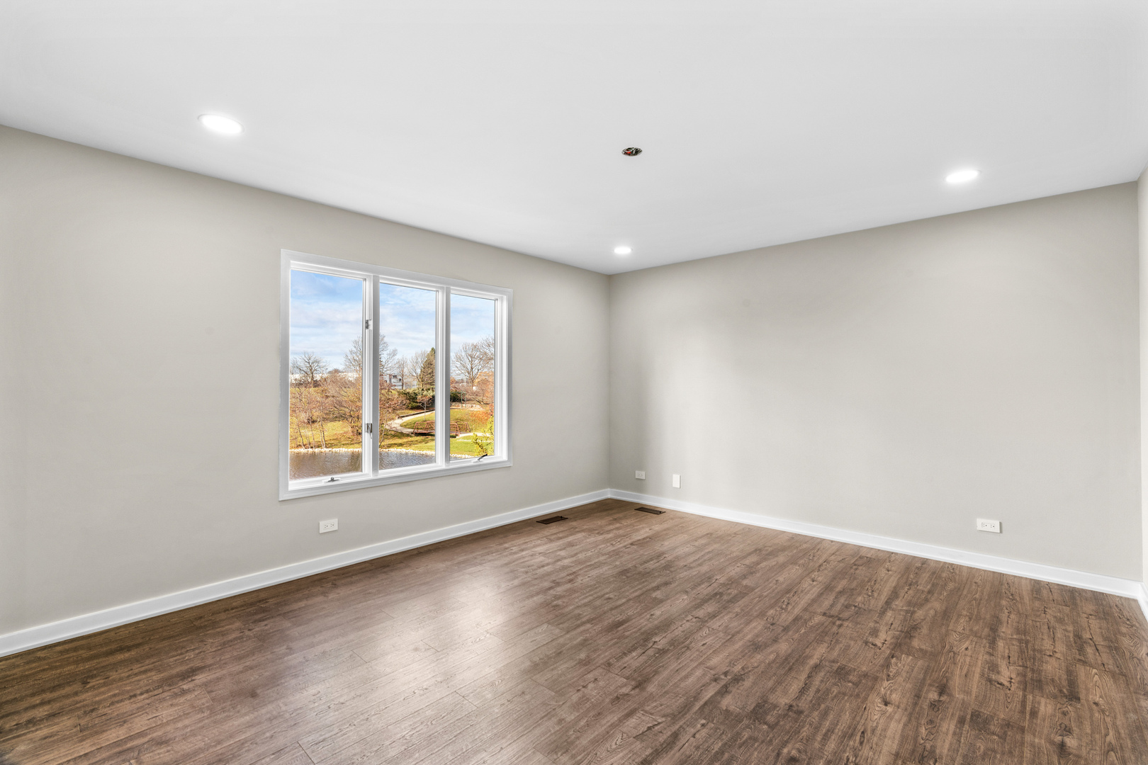 2500 Osage Drive Glenview, IL 60026 - Photo 39 of 77 an empty room with wooden floor and windows
