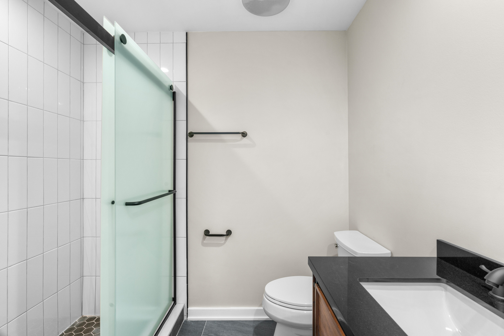 2500 Osage Drive Glenview, IL 60026 - Photo 41 of 77 a bathroom with a toilet a sink and shower