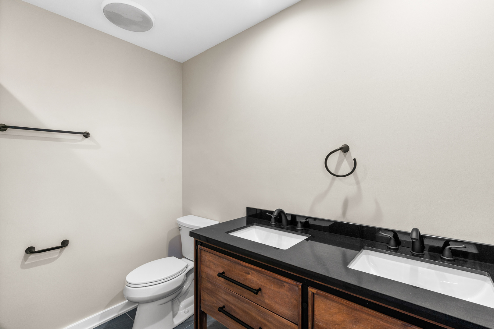 2500 Osage Drive Glenview, IL 60026 - Photo 42 of 77 a bathroom with a granite countertop sink and a mirror