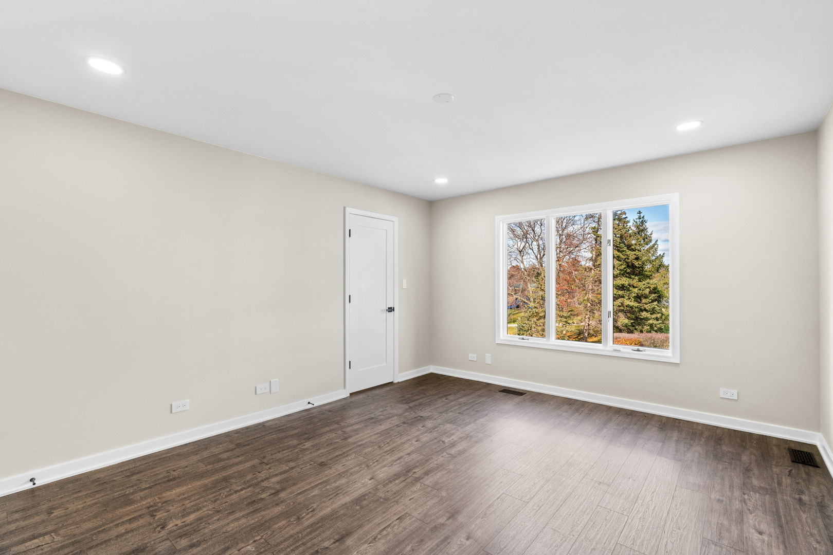 2500 Osage Drive Glenview, IL 60026 - Photo 43 of 77 an empty room with wooden floor and windows