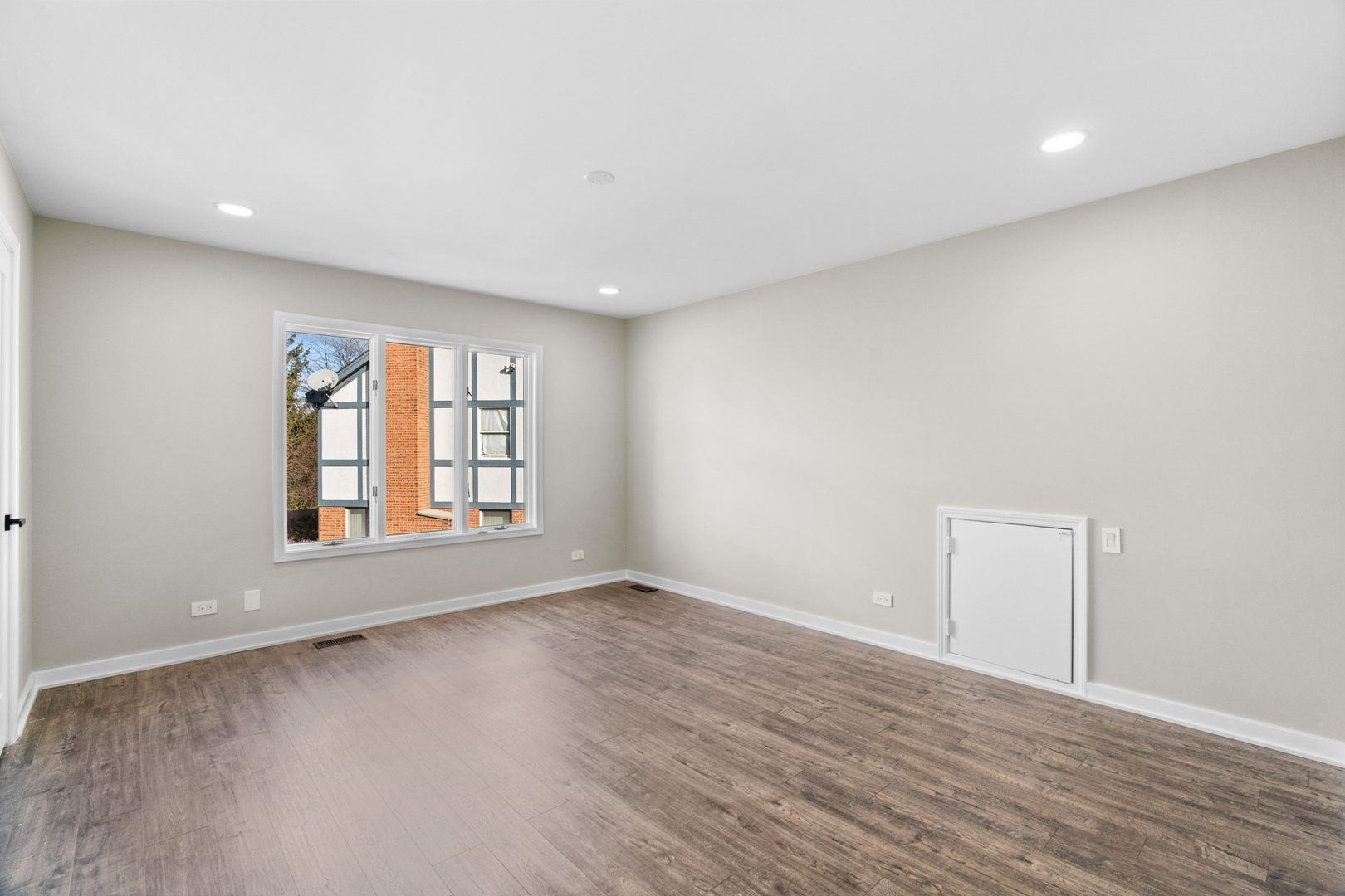 2500 Osage Drive Glenview, IL 60026 - Photo 44 of 77 an empty room with wooden floor and windows