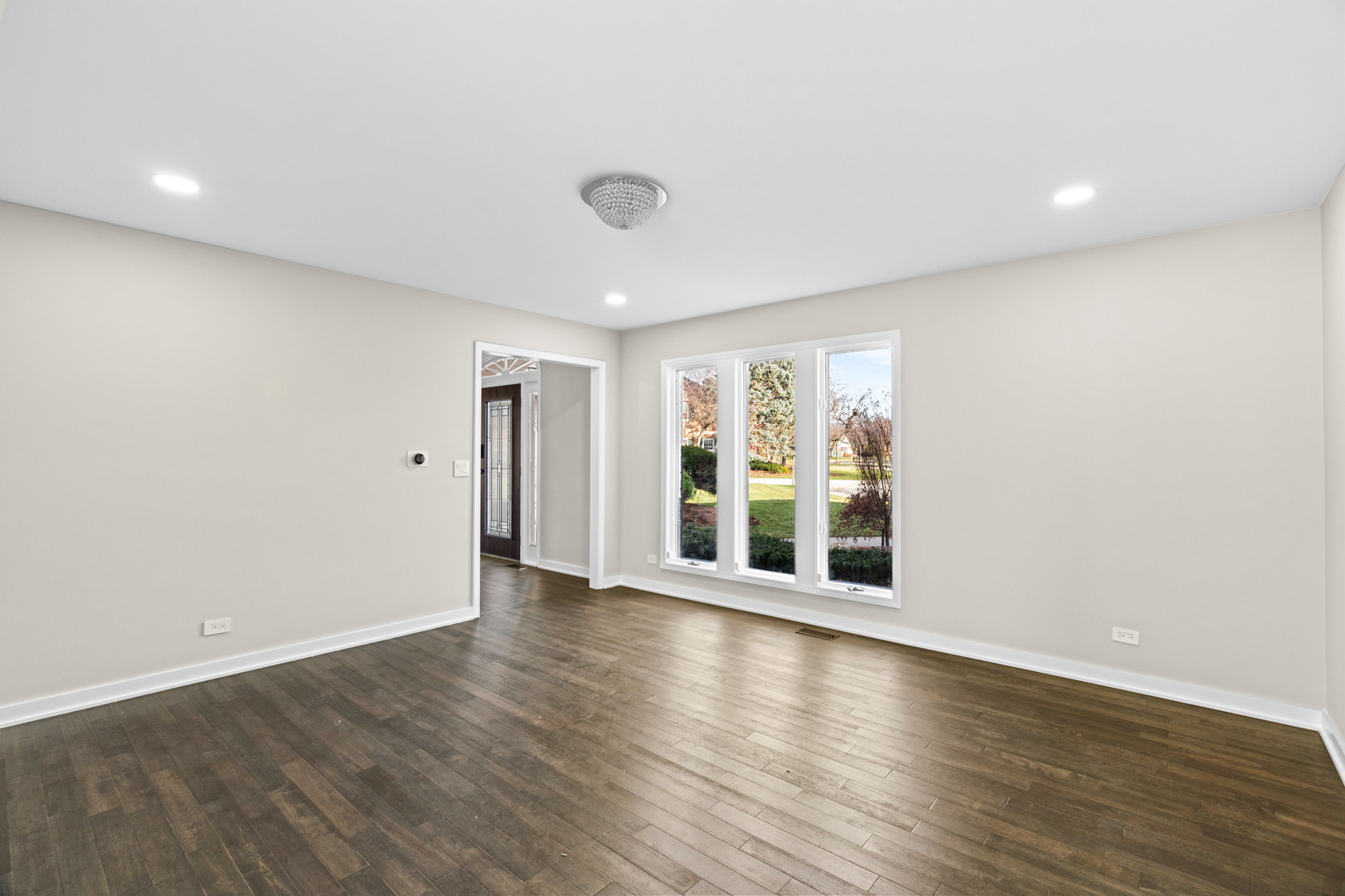 2500 Osage Drive Glenview, IL 60026 - Photo 50 of 77 a view of an empty room with wooden floor and a window