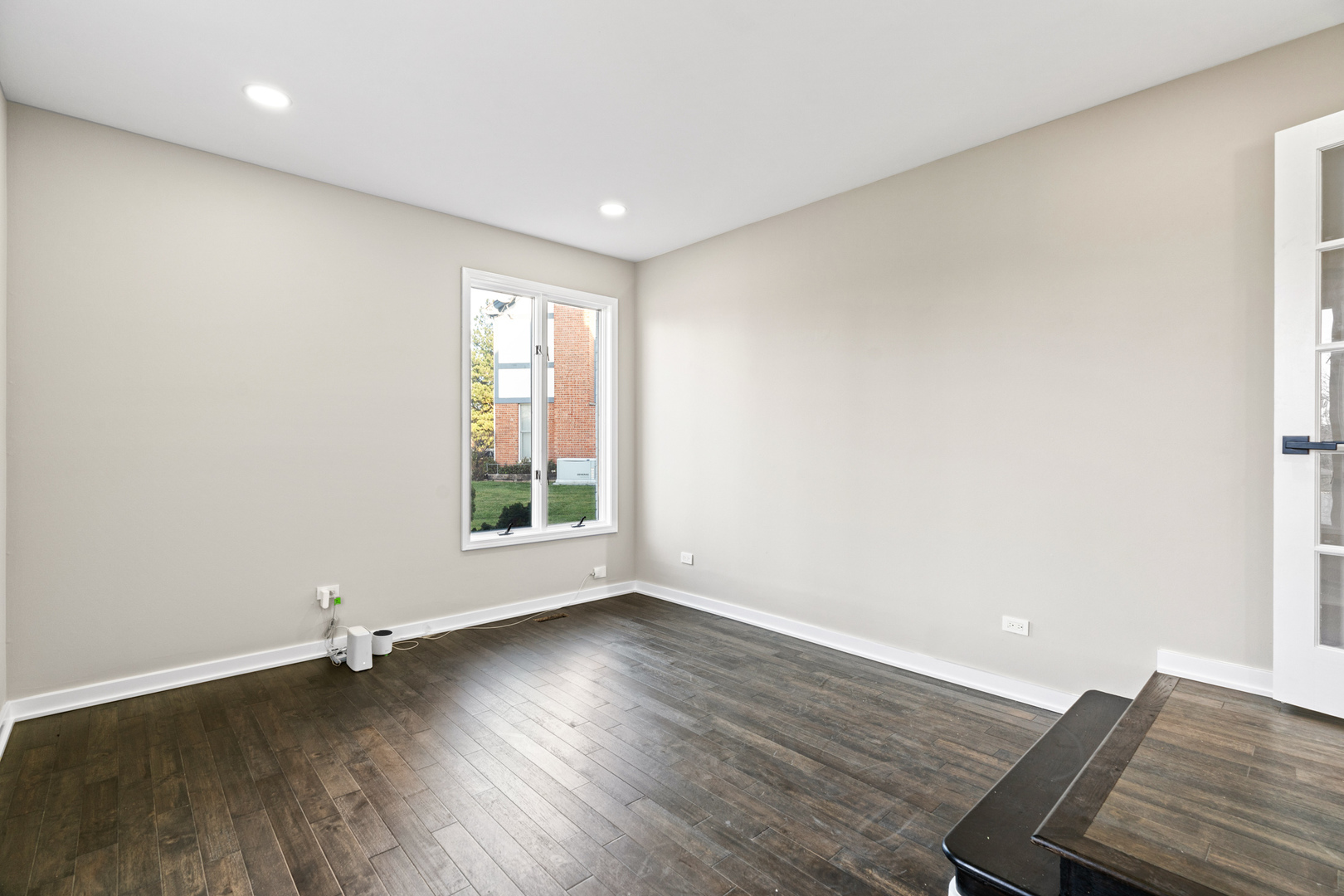 2500 Osage Drive Glenview, IL 60026 - Photo 54 of 77 an empty room with wooden floor and windows