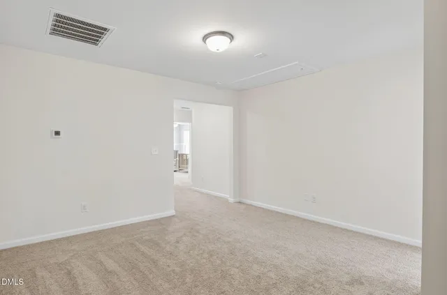 a en suite bathroom with a shower and a sink