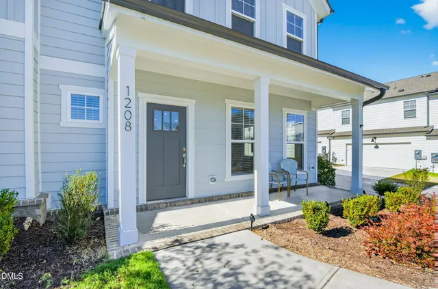 a front view of a house with a porch
