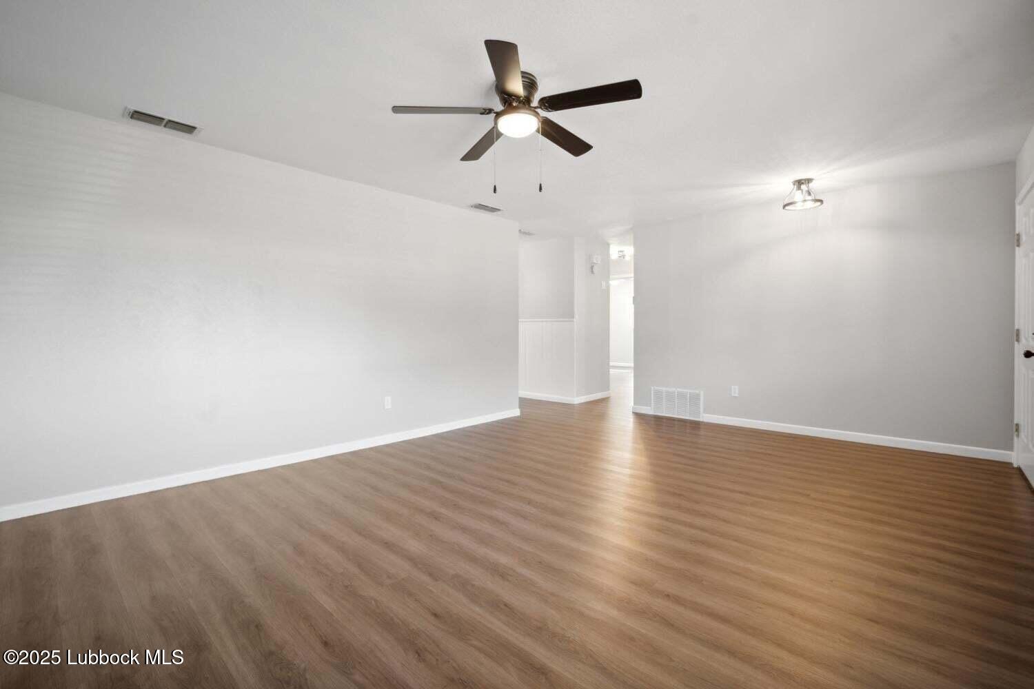 2004 45th Street Lubbock, TX 79412 - Photo 14 of 18 wooden floor in an empty room