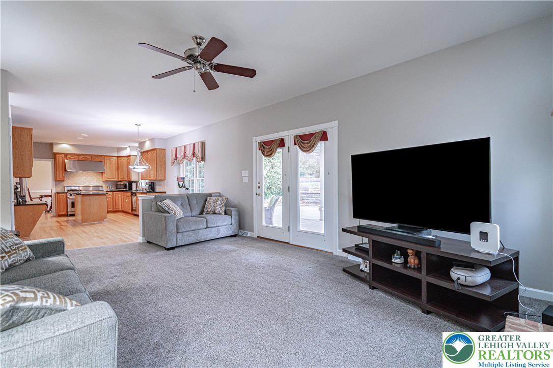 6551 Overlook Road Orefield, PA 18069 - Photo 32 of 82 a living room with furniture and a flat screen tv