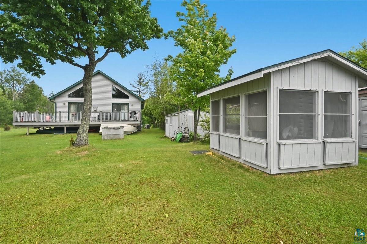 8162 South Dowling Road West Superior, WI 54880 - Photo 11 of 15 Spacious backyard with a detached screened-in outbuilding, a multi-level deck, and a shed