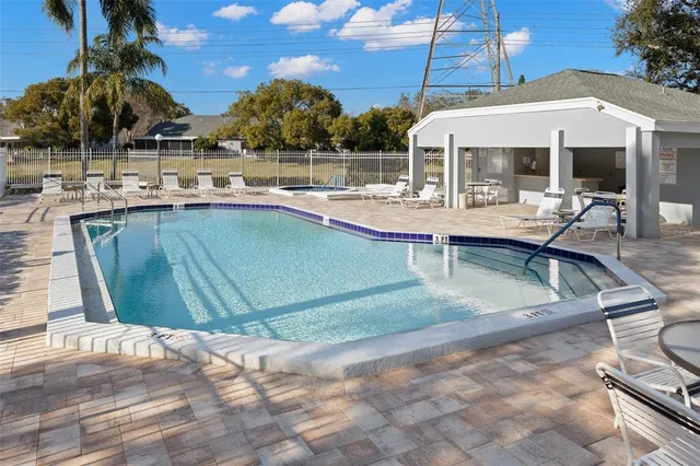 a view of a swimming pool with a patio