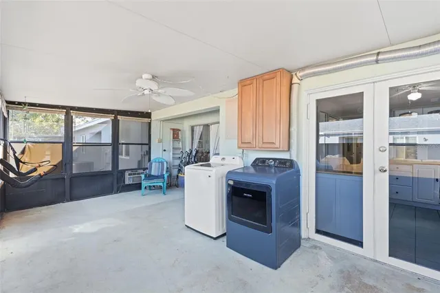 a view of a livingroom with furniture cabinet and a fireplace