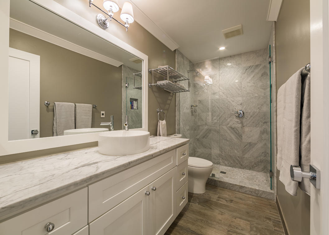 3375 Foothill Road, Unit 213 Carpinteria, CA 93013 - Photo 11 of 25 a bathroom with a double vanity sink toilet and shower