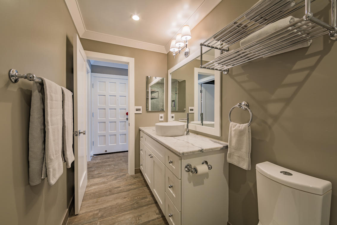 3375 Foothill Road, Unit 213 Carpinteria, CA 93013 - Photo 12 of 25 a bathroom with a sink a toilet a mirror and shower