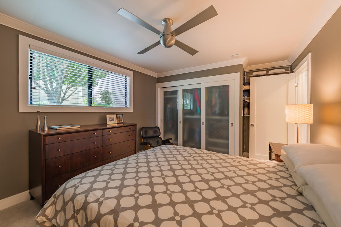 3375 Foothill Road, Unit 213 Carpinteria, CA 93013 - Photo 15 of 25 a bedroom with a large bed and a large window