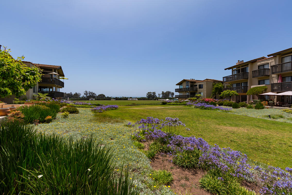 3375 Foothill Road, Unit 213 Carpinteria, CA 93013 - Photo 17 of 25 a view of yard with outdoor seating and car parked