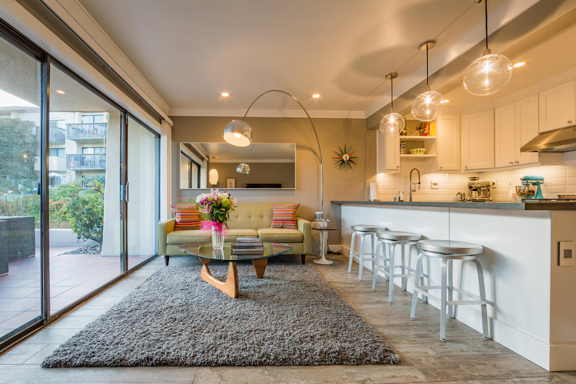 3375 Foothill Road, Unit 213 Carpinteria, CA 93013 - Photo 3 of 25 a living room filled with furniture and a table