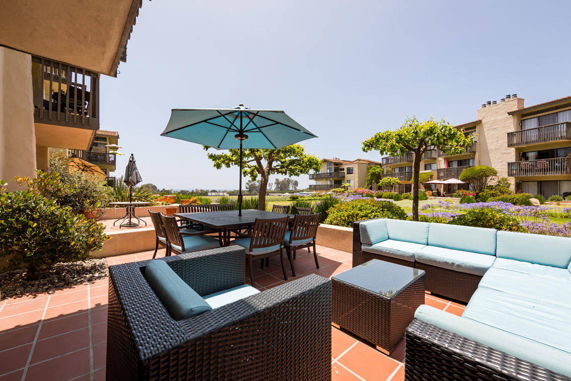 3375 Foothill Road, Unit 213 Carpinteria, CA 93013 - Photo 5 of 25 a view of a patio with couches potted plants and a table