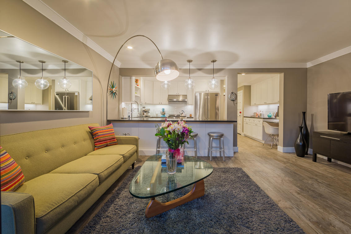 3375 Foothill Road, Unit 213 Carpinteria, CA 93013 - Photo 6 of 25 a living room with furniture and a chandelier