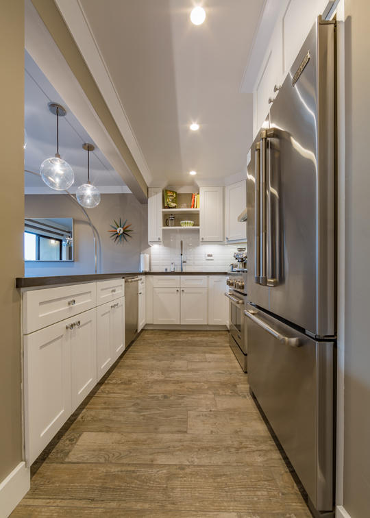 3375 Foothill Road, Unit 213 Carpinteria, CA 93013 - Photo 8 of 25 a kitchen with stainless steel appliances granite countertop a refrigerator and a sink