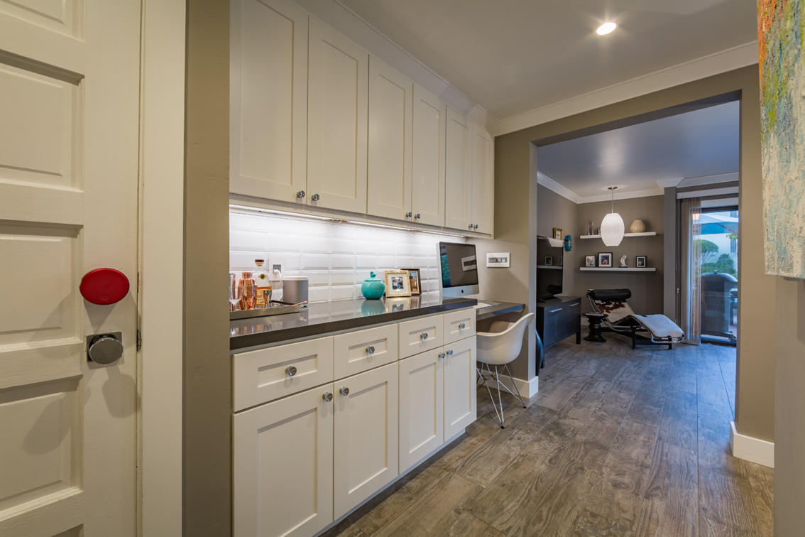 3375 Foothill Road, Unit 213 Carpinteria, CA 93013 - Photo 9 of 25 a kitchen with white cabinets and white appliances