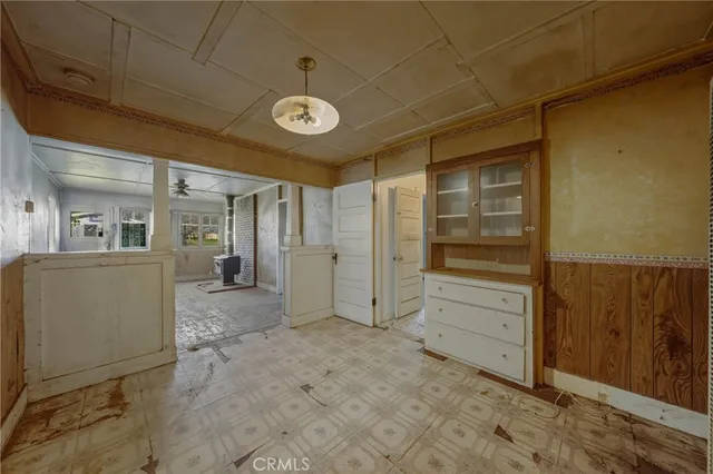 a kitchen with stainless steel appliances granite countertop a sink and a refrigerator