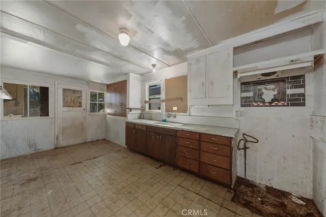 a view of a kitchen with a sink and dishwasher