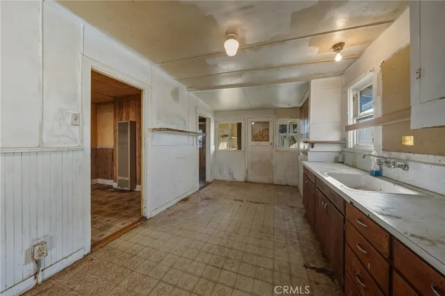 a view of a hallway with a glass door shower
