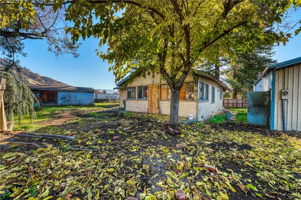 3527 Highway 20 Nice, CA 95464 - Photo 22 of 29 front view of a house with a tree