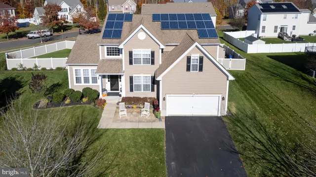 a view of multiple houses with a yard