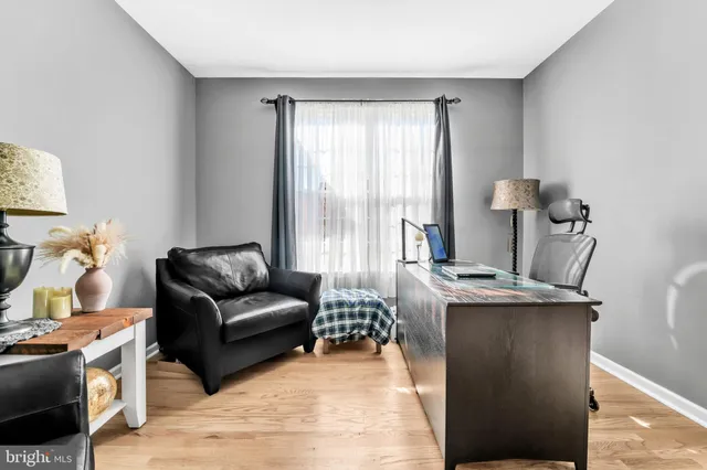 a living room with a couch and a stove top oven