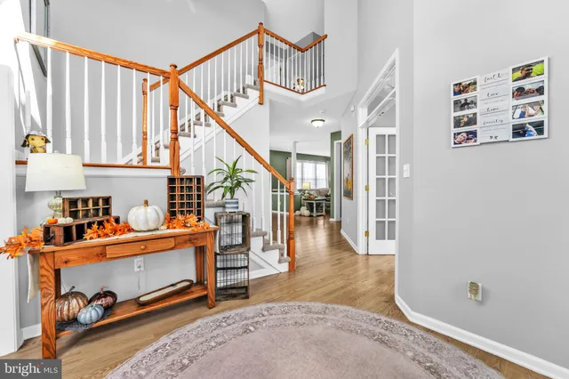 a dining room with furniture and a chandelier