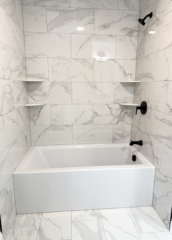 26 Marlyn Road Billerica, MA 01821 - Photo 16 of 36 a bathroom with a bathtub