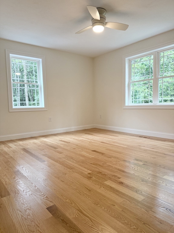 26 Marlyn Road Billerica, MA 01821 - Photo 18 of 36 an empty room with wooden floor and windows