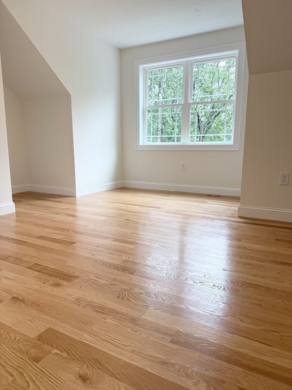 26 Marlyn Road Billerica, MA 01821 - Photo 19 of 36 a view of an empty room with wooden floor and a window