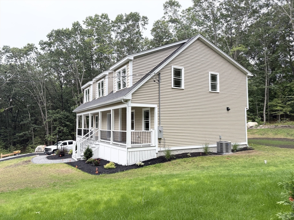 26 Marlyn Road Billerica, MA 01821 - Photo 24 of 36 a front view of a house with a garden