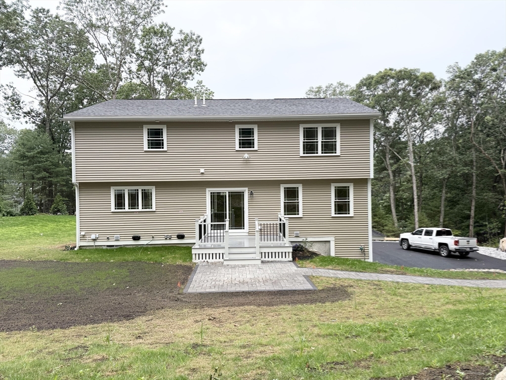 26 Marlyn Road Billerica, MA 01821 - Photo 26 of 36 a front view of a house with a yard table and chairs