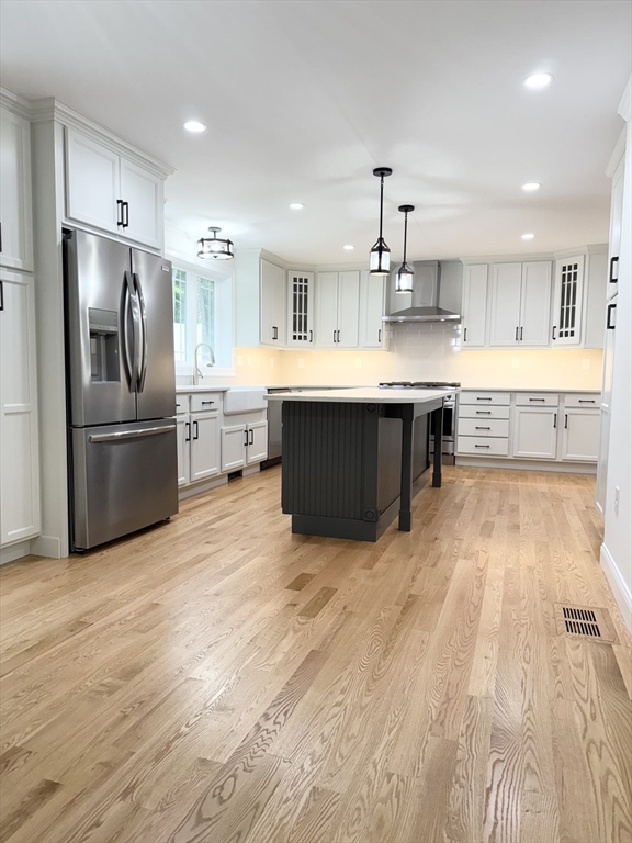 26 Marlyn Road Billerica, MA 01821 - Photo 3 of 36 a large kitchen with kitchen island a large counter top space stainless steel appliances and cabinets