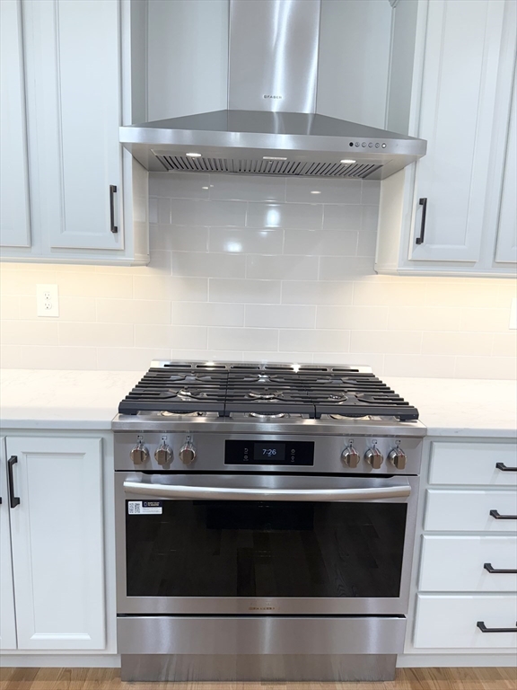 26 Marlyn Road Billerica, MA 01821 - Photo 9 of 36 a stove top oven sitting inside of a kitchen