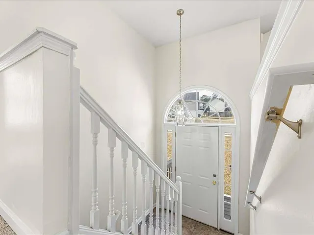 a view of an entryway with hardwood floor