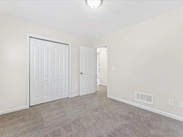 a white bath tub sitting next to a window