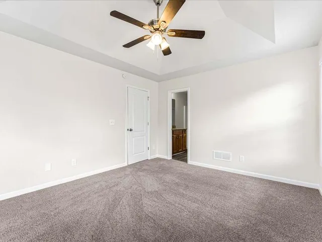 an empty room with closet area